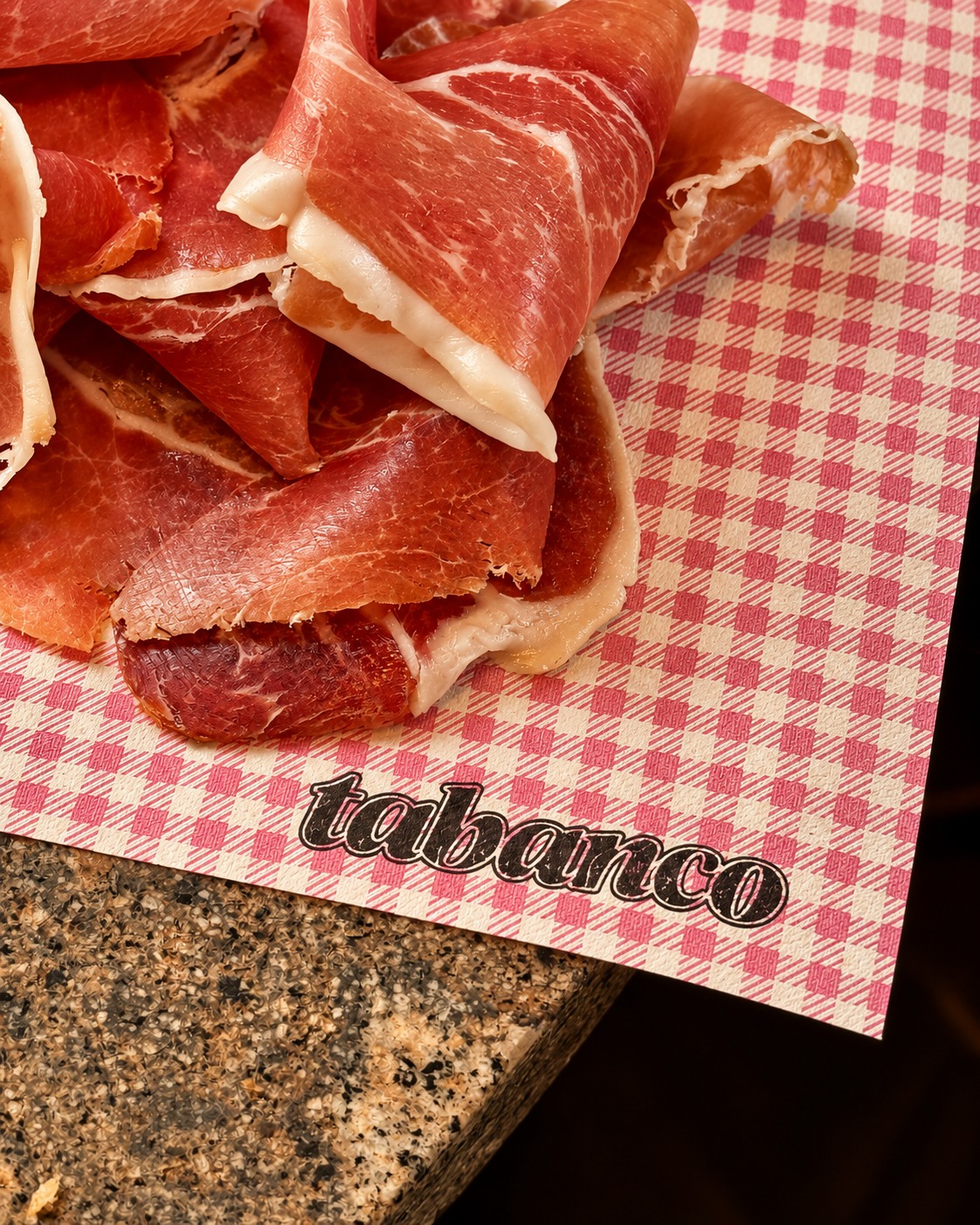 Cured ham on Tabanco gingham paper