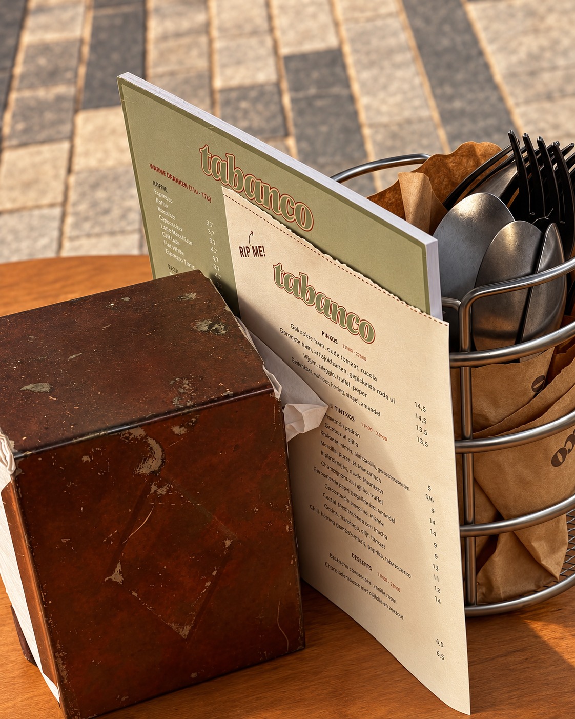 The printed menu tucked beside the cutlery basket
